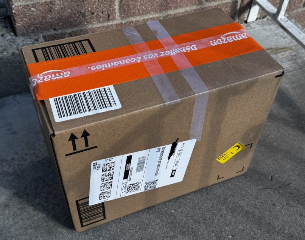 Amazon return box for the AquaSonic Duo Series electric toothbrush set, packed and labeled for shipping.